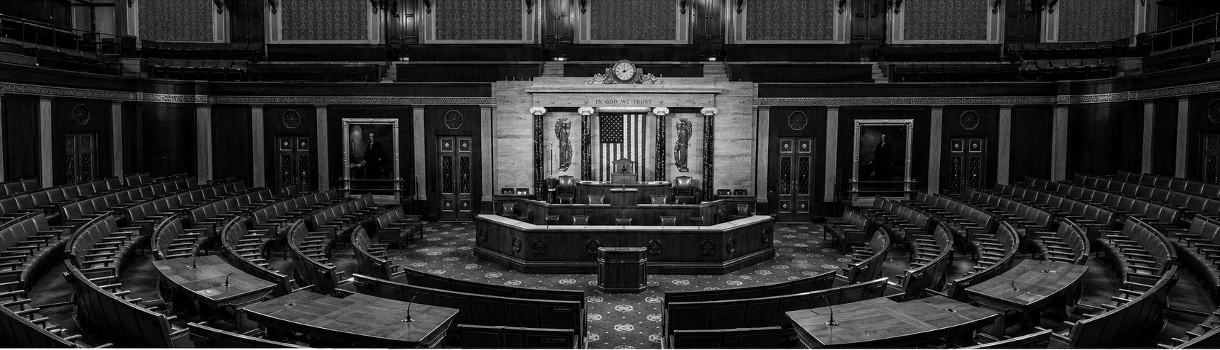 The chamber of the U.S. House of Representatives, semicircular seating under gallery light
