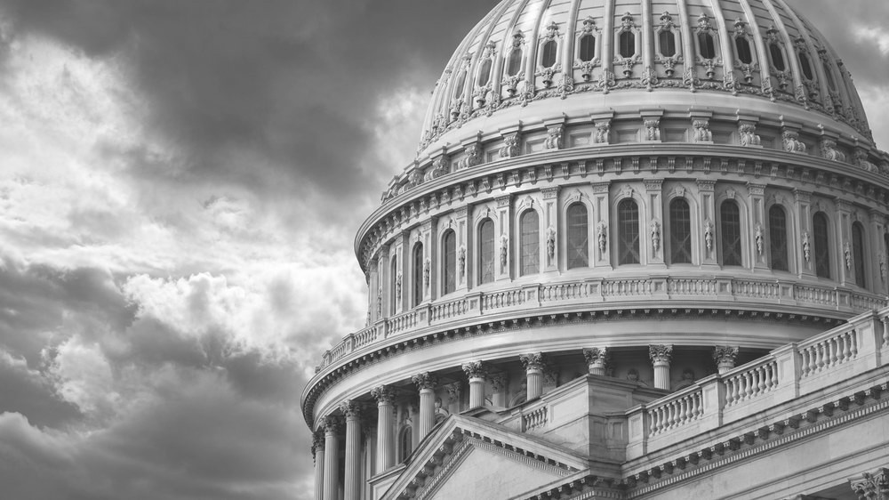 The Capitol dome against storm light
